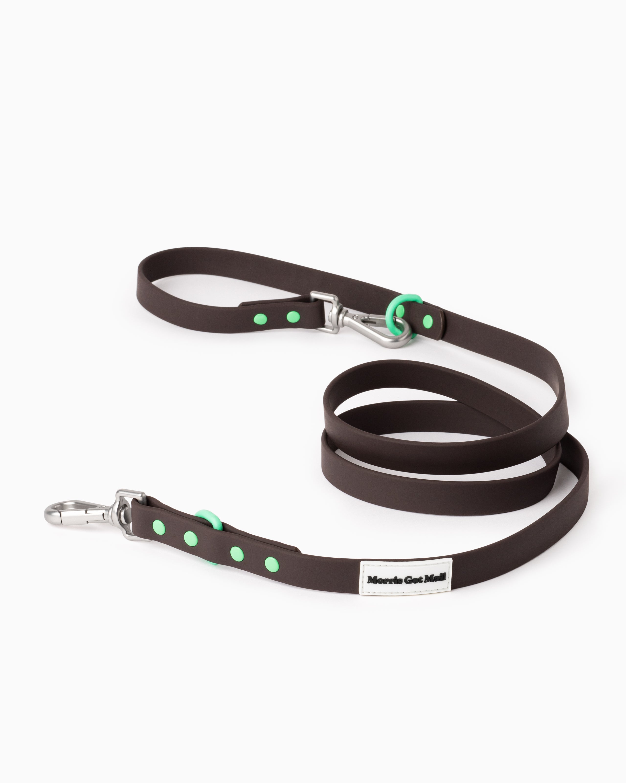 Dark brown waterproof & odor resistant dog leash with a two tone colorblock design, two length options, a handle, carbon coated steel hardware, & zinc alloy attachment hooks.